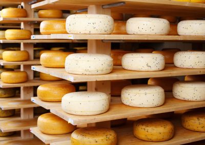 Cheese Wheels On A Shelf