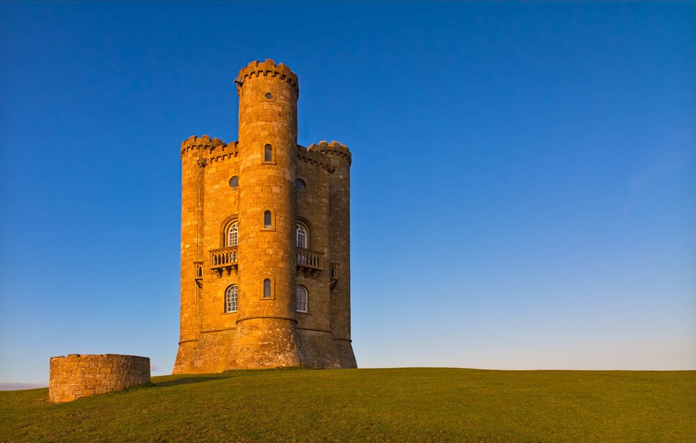 Tower On A Hill With Blue Skies