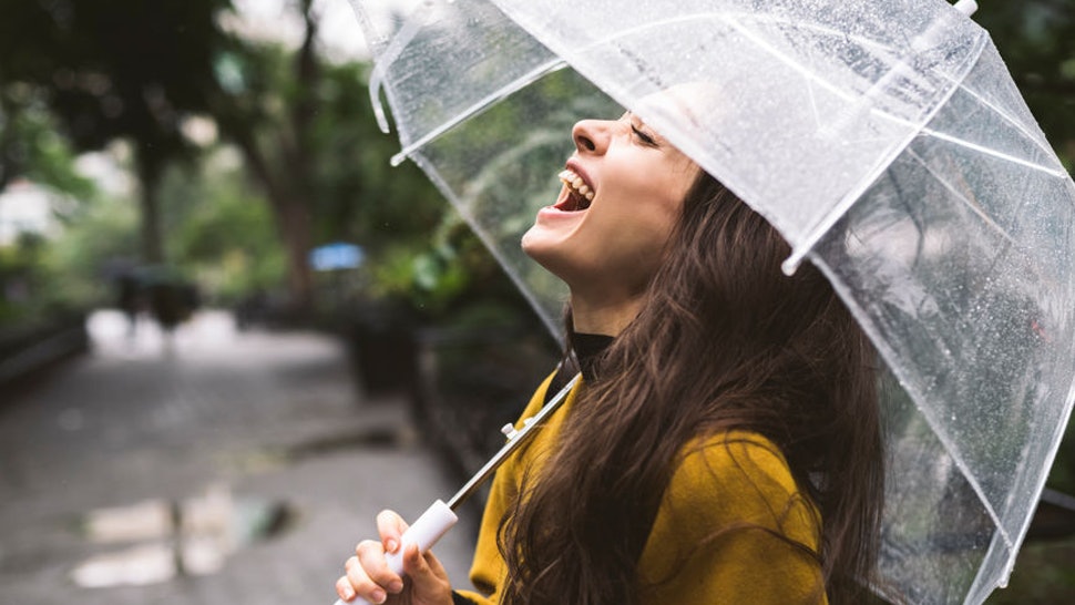 Girl Under An Umbrella In The Rain
